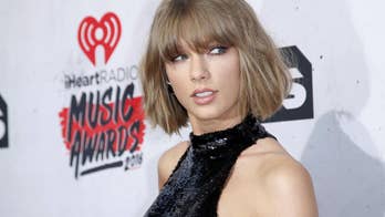 Taylor Swift shocks Target shoppers by surprising fans in music aisle