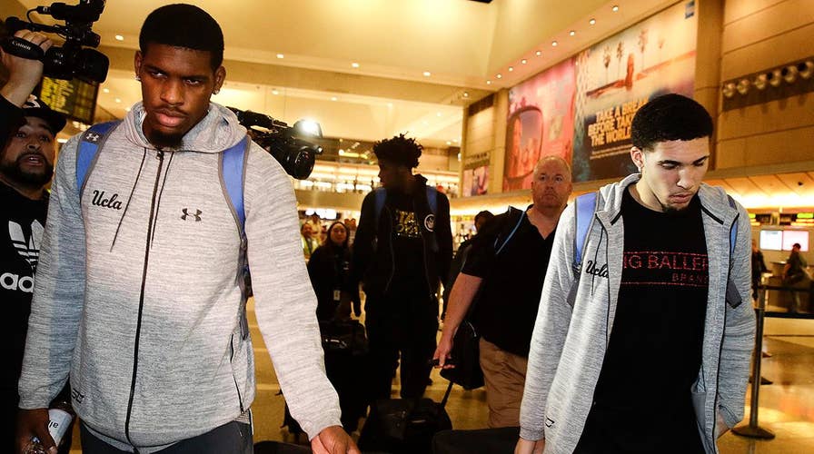 Basketball players accused of stealing in China return to LA