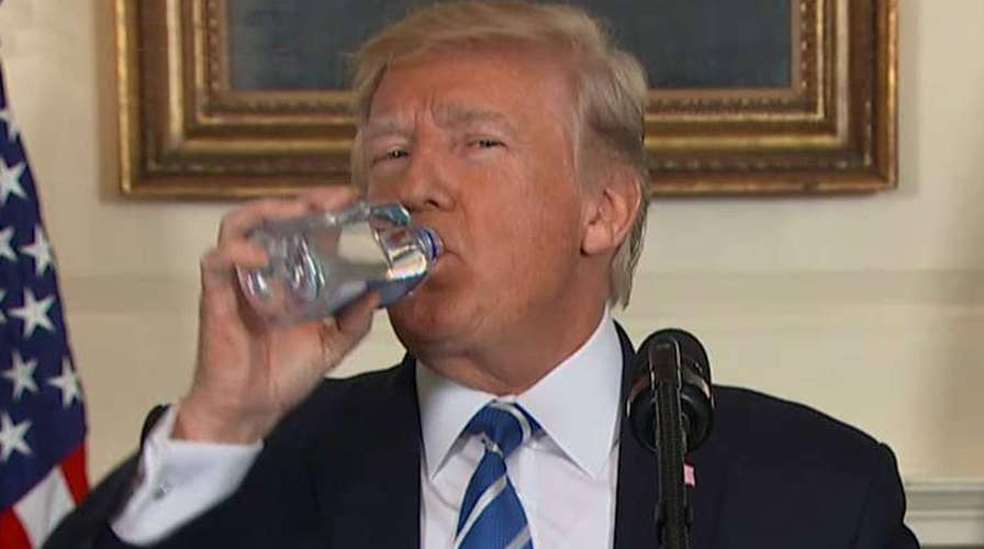 President Trump pauses for a water break