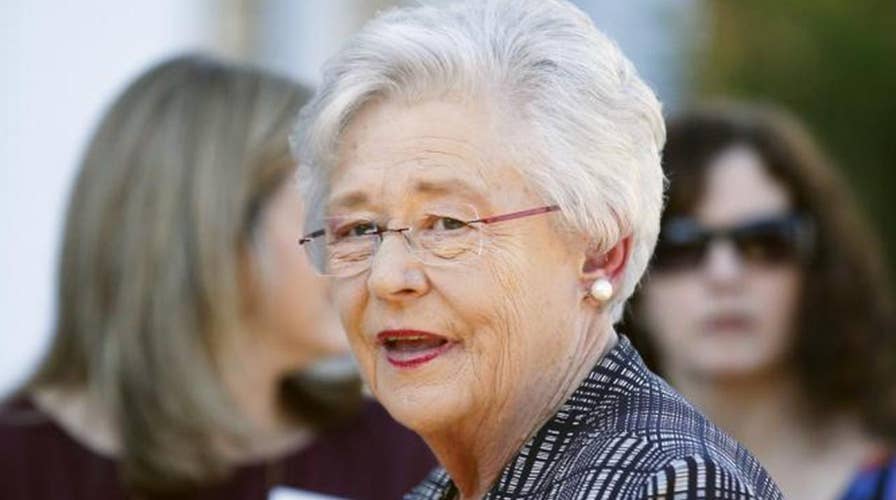 Alabama governor says she will vote for Roy Moore