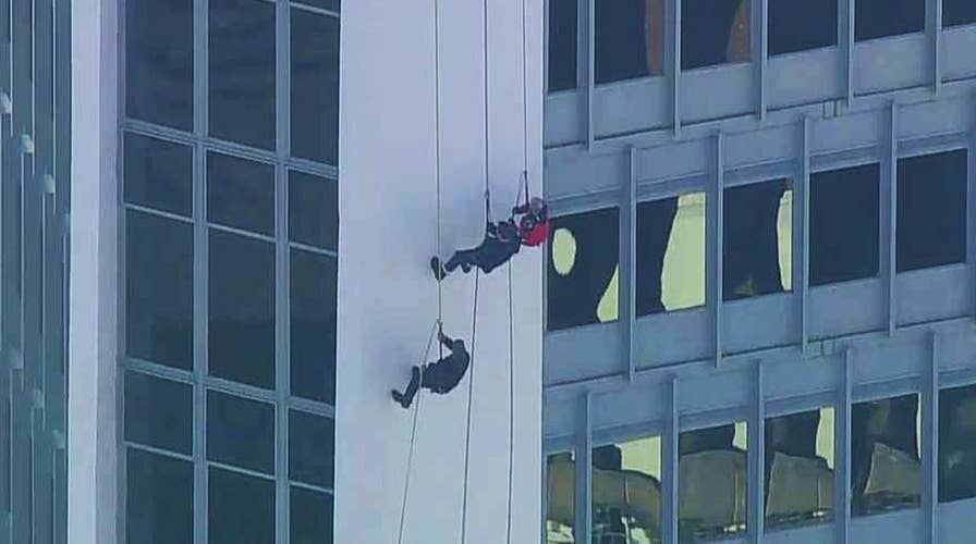 Todd Piro rappels like Santa to kick off Stamford's big event