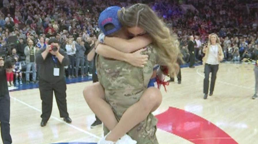 Returning soldier surprises 76ers dancer during game