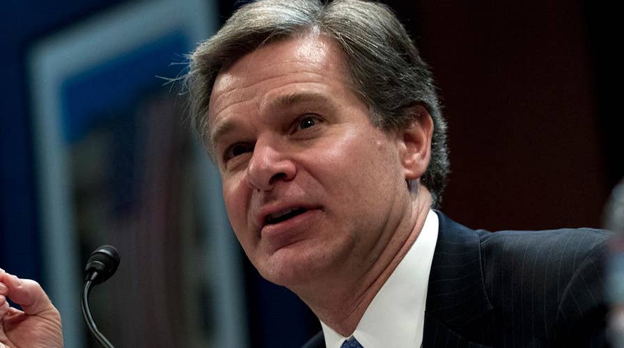FBI's Wray questioned on handling of Clinton email probe
