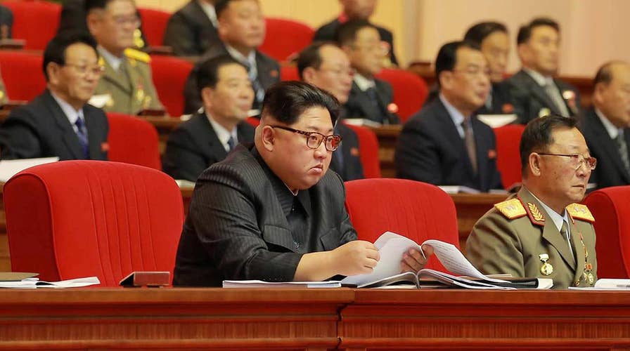 New images show Kim Jong Un with missile scientists
