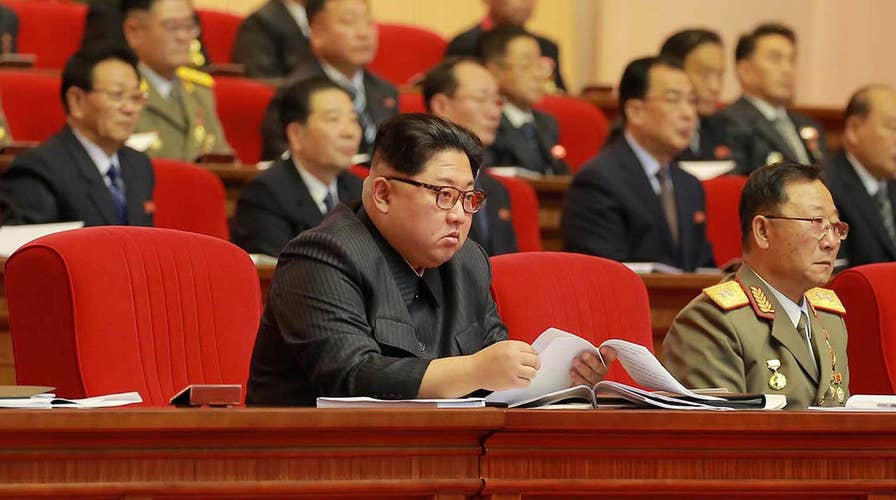 New images show Kim Jong Un with missile scientists