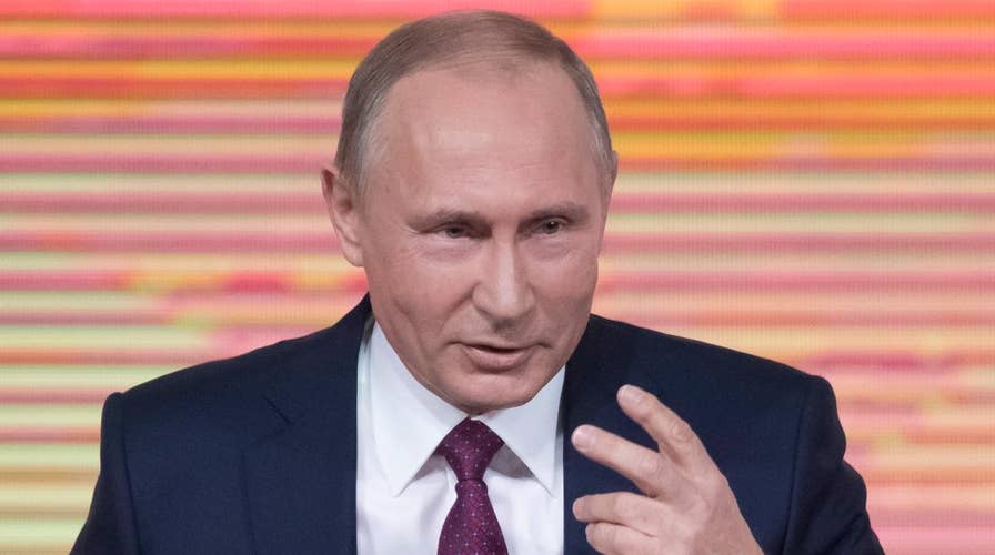 Putin denies election meddling at year-end news conference