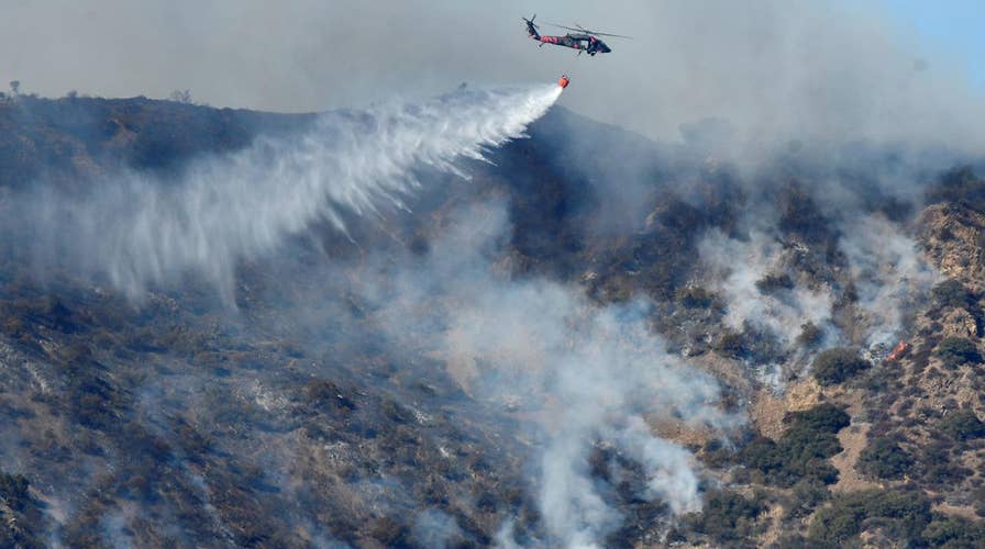 Battle rages to contain Thomas wildfire in California