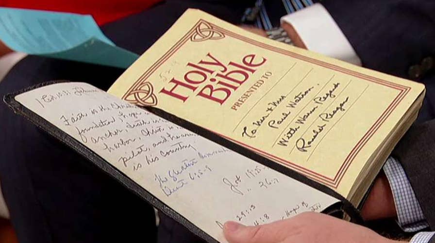 Unveiling a bible signed by Ronald Reagan
