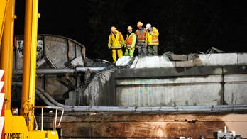 Amtrak engineer in deadly wreck may have been distracted, official says