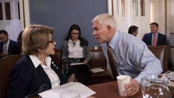 Focus shifts from tax bill to spending showdown in DC