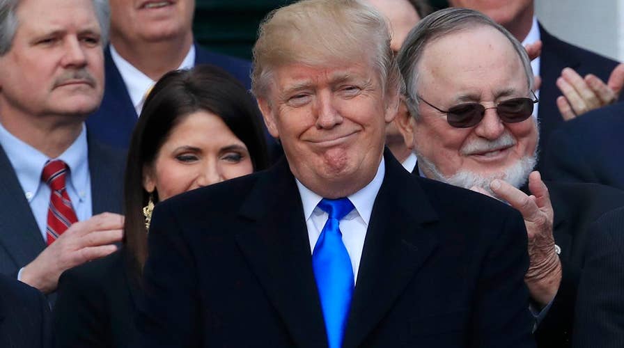 Trump celebrates achieving the centerpiece of his campaign