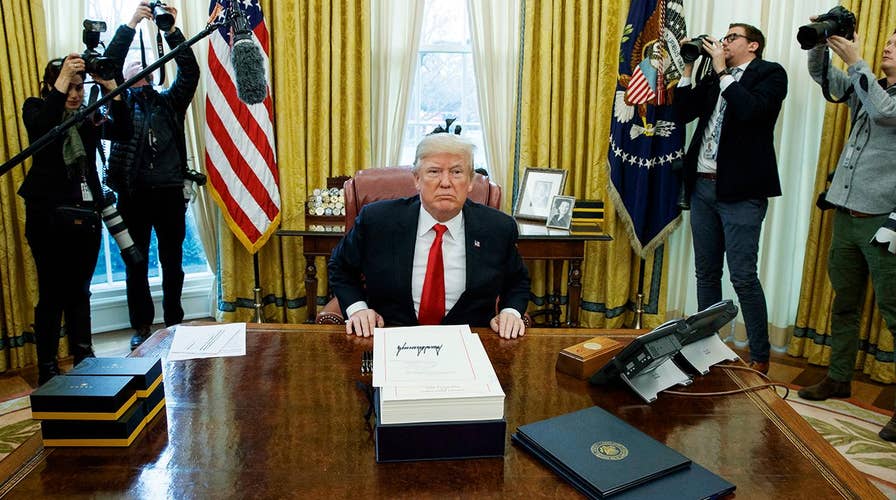 New details uncovered as Trump signs tax cuts bill into law