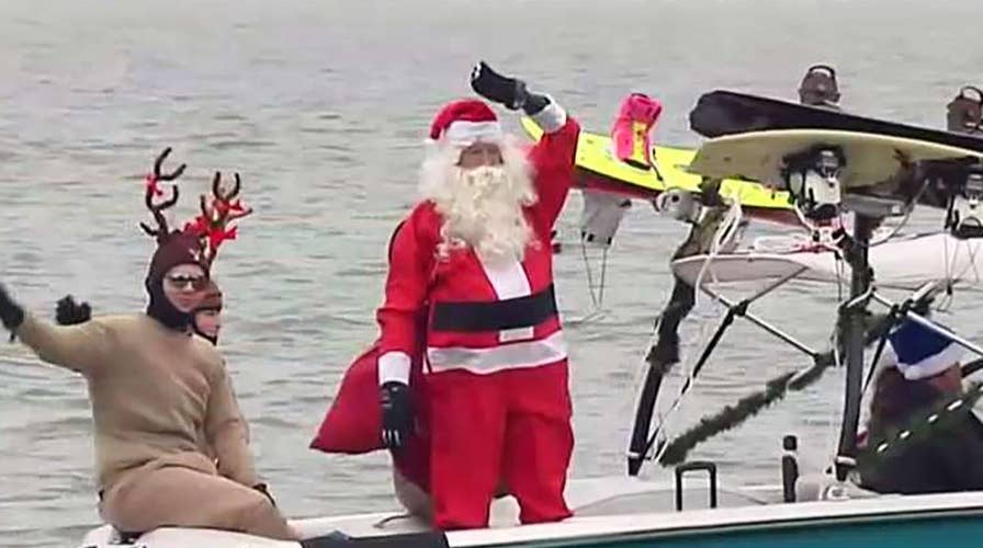 Santa and the Grinch waterski down the Potomac River