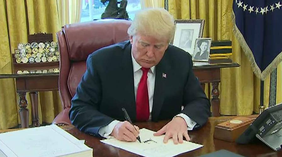 Trump, Congress look to ride wave of momentum into 2018