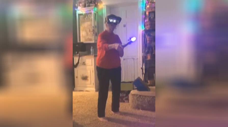 Grandmother battles Darth Maul with a lightsaber