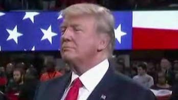 Trump stands for national anthem at NCAA game; Alabama player heard saying 'F--- Trump'