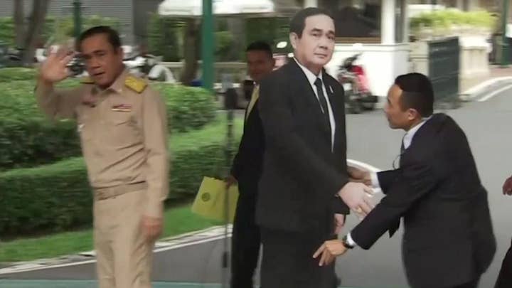Thai PM leaves cardboard cutout to answer press' questions