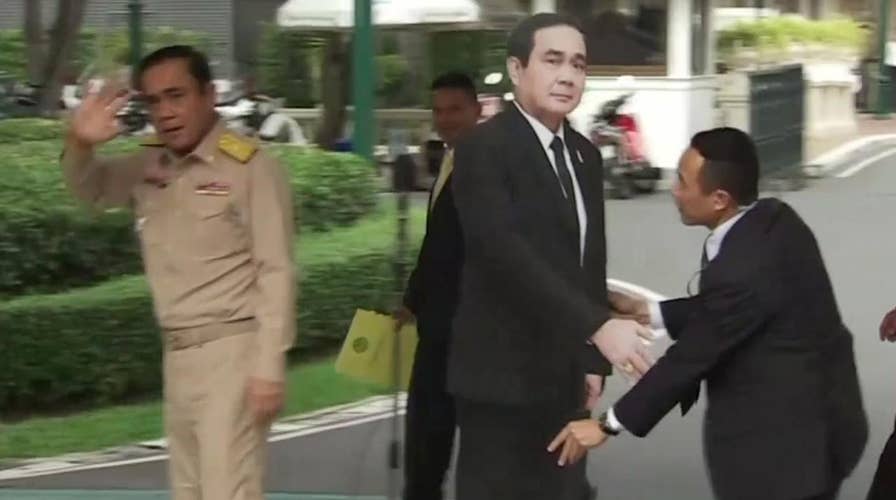 Thai PM leaves cardboard cutout to answer press' questions