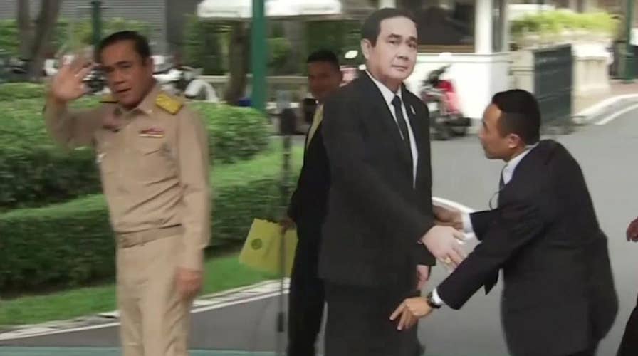 Thai PM leaves cardboard cutout to answer press' questions