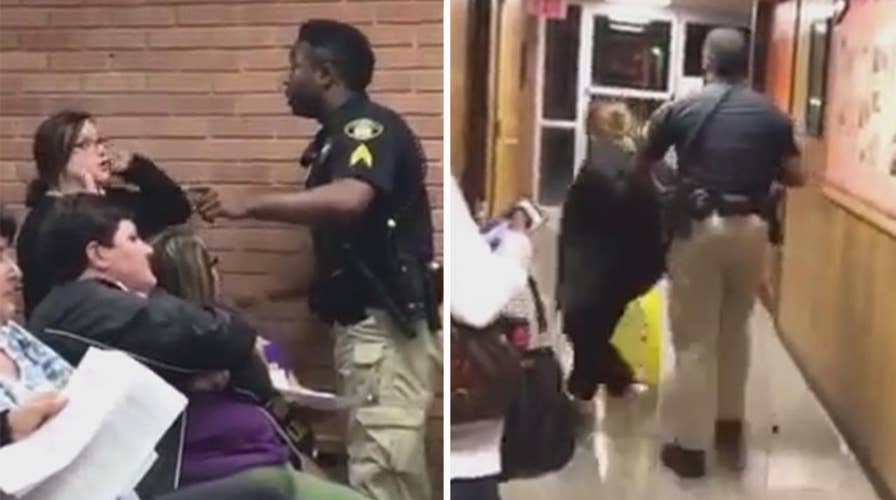 Teacher forcibly removed, arrested at school board meeting