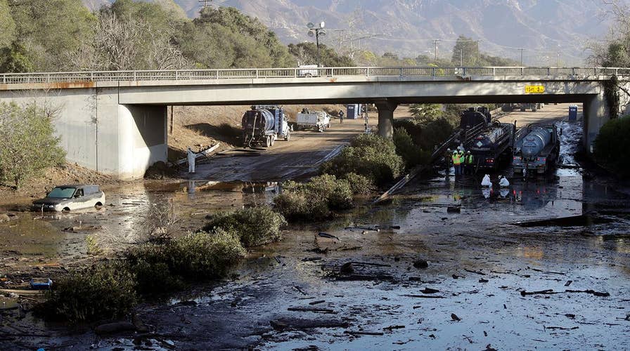 Crews working inch by inch to clear mud off 101 Freeway