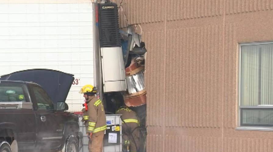 Truck veers off highway, crashes into school