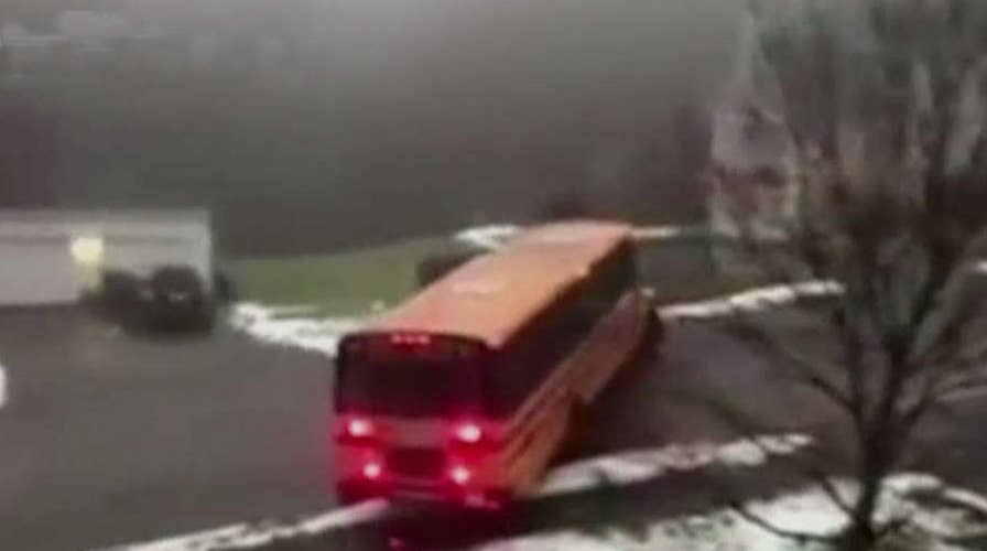 School bus slides backwards down icy street in Massachusetts