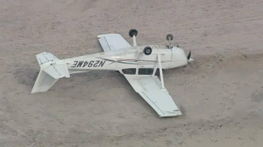 Plane flips after emergency landing on New York beach