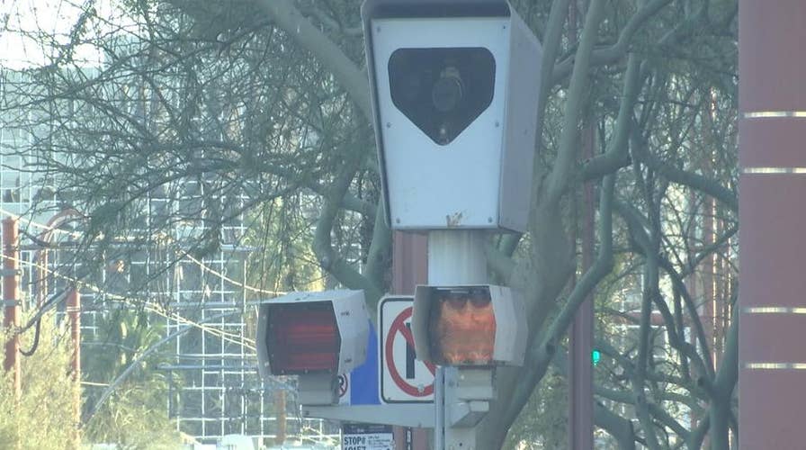 Photo red light, speed enforcement at intersection of debate