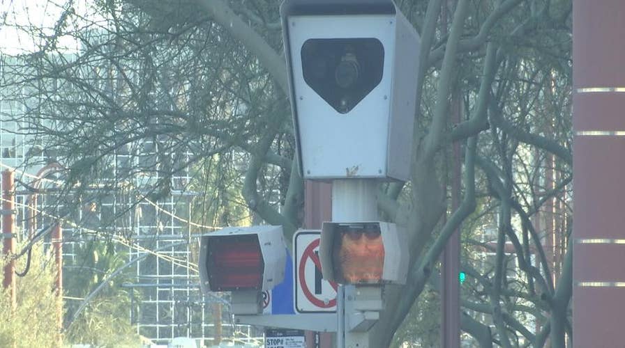 Photo red light, speed enforcement at intersection of debate