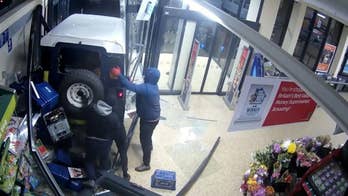 Crooks use stolen SUV to smash into store and steal ATM