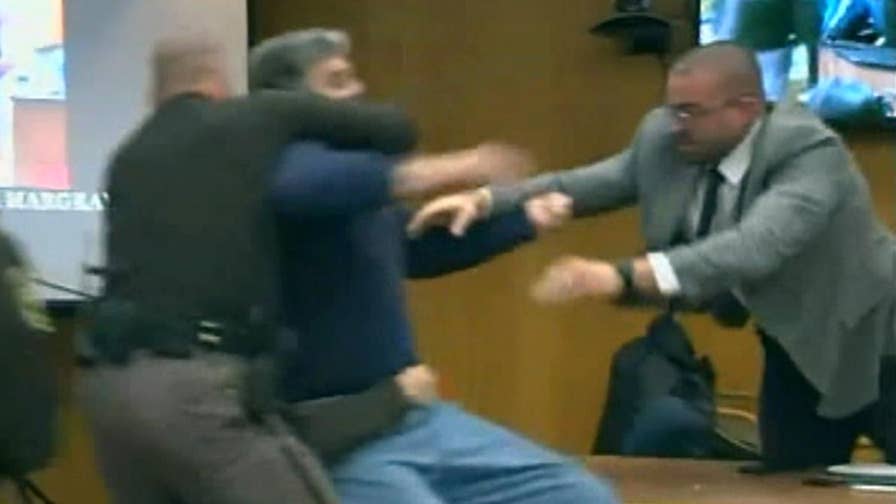 Man subdued during court appearance for disgraced gymnastics doctor.