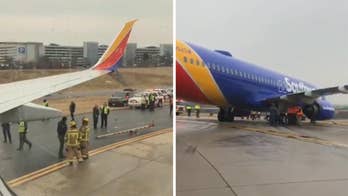 Emergency crews 'everywhere' after Southwest flight slumps forward on nose after skidding off taxiway in Maryland