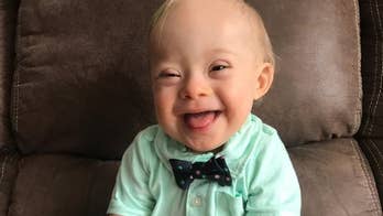 Utter cuteness! Down syndrome boy steals Gerber execs' hearts in photo contest