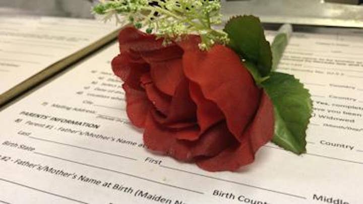 Couples obtain marriage licenses at Vegas airport 