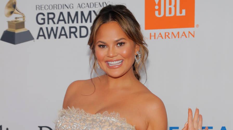 Chrissy Teigen shares pregnant topless photo