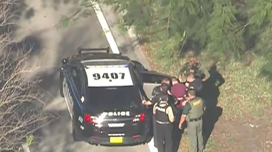 Person of interest in custody after Florida school shooting