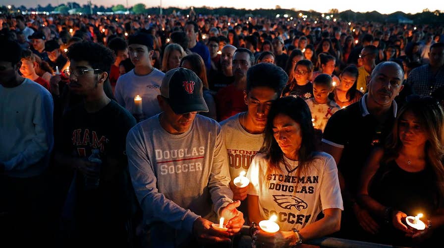 Hundreds attend vigil for victims of deadly school shooting