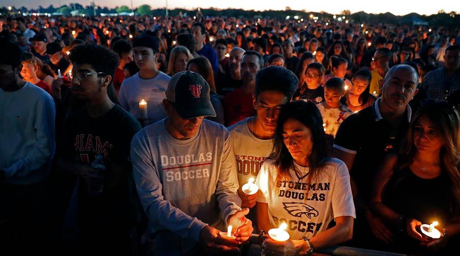 Hundreds attend vigil for victims of deadly school shooting