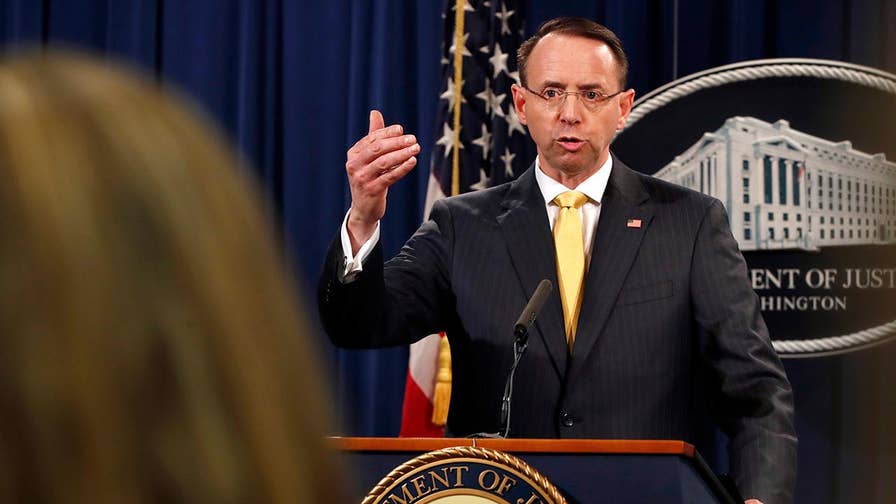 Deputy Attorney General Rosenstein says the defendants posed as politically and socially active Americans to engage in informational warfare during presidential election and the early days of the Trump administration; no allegation in indictment that any American had knowledge of Russian activities. 