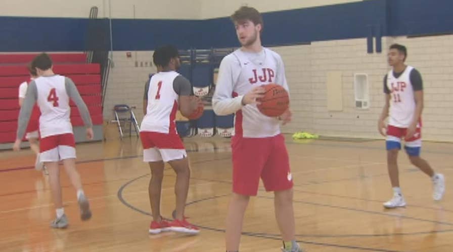 High school basketball team saves family from house fire