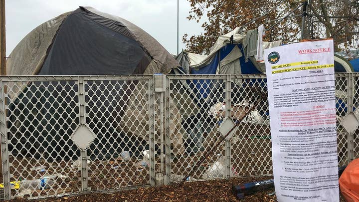 Orange County officials begin clearing massive homeless camp