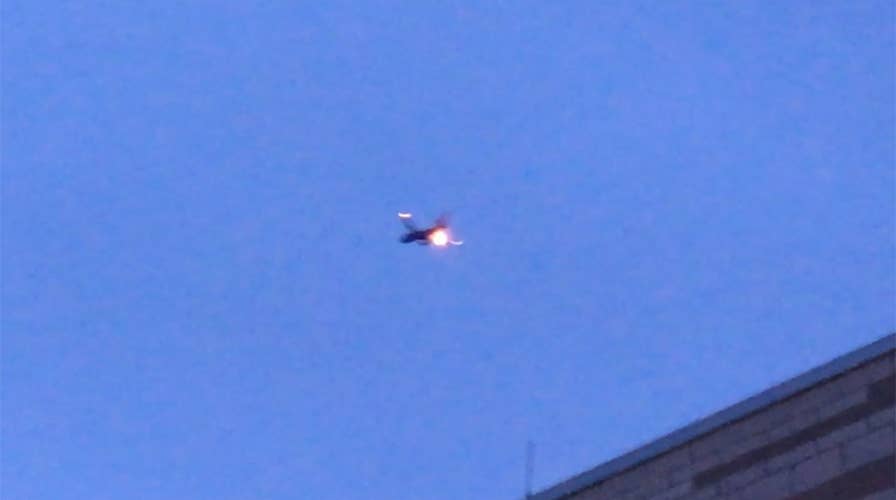 Southwest plane’s engine burst into flames midair