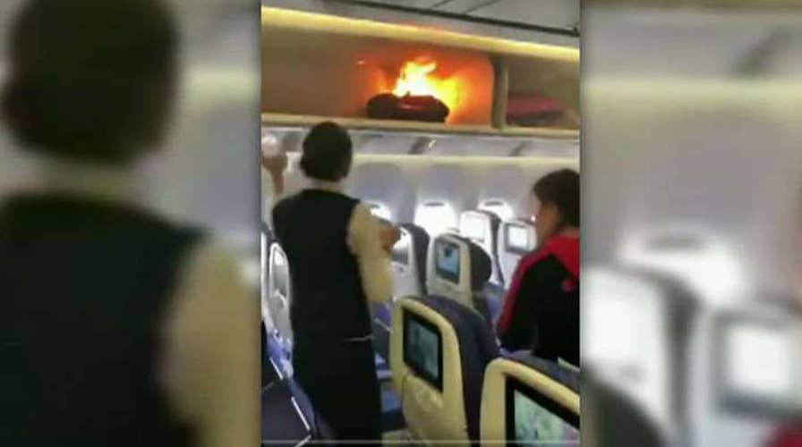 Power bank catches fire in airplane overhead bin