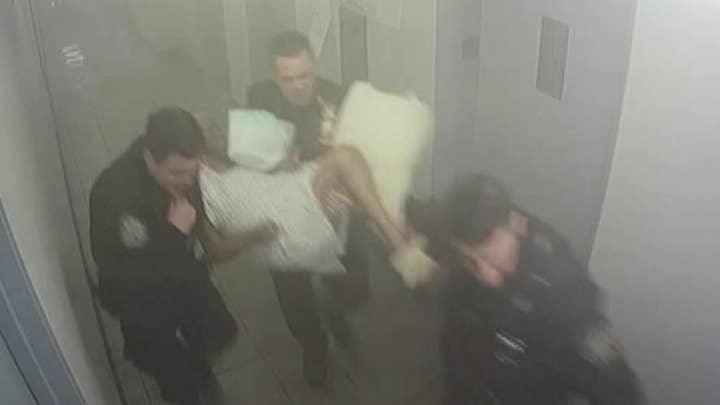 Cops accused of letting woman die in smoke-filled hallway