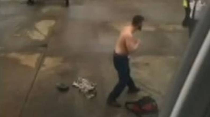 Shirtless tarmac fight: Unruly passenger picks fight with airport crew