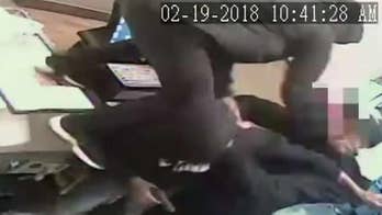 Pizza Hut employee fends off three armed robbers in crazy security footage