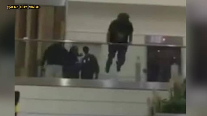 Shocking video: Man jumps over railing at Atlanta airport