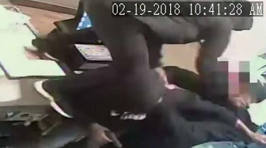Pizza Hut clerk takes on three armed robbers