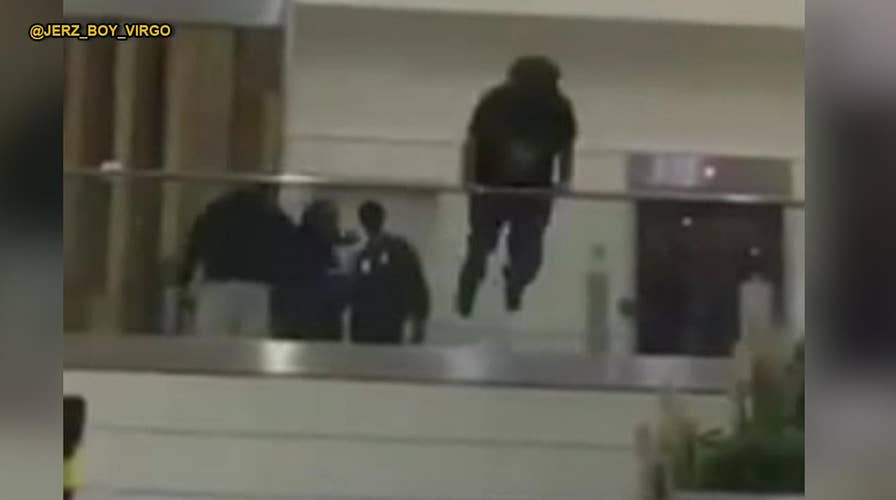 Shocking video: Man jumps over railing at Atlanta airport